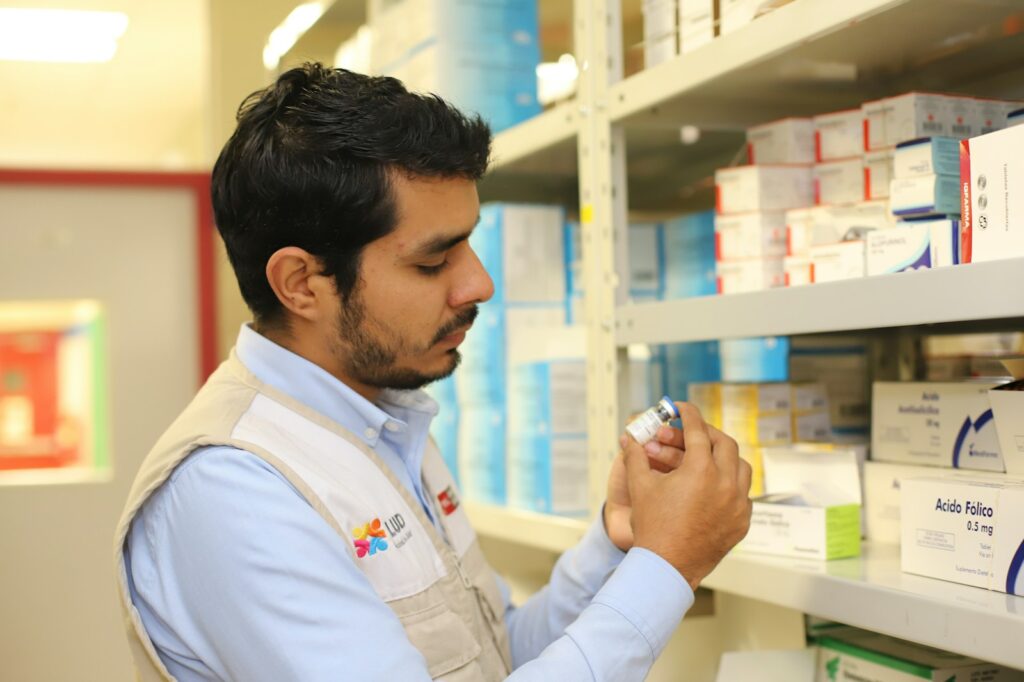 a man holding a small object